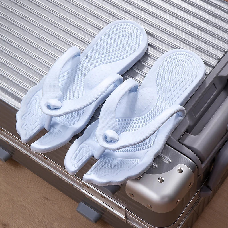 A pair of portable folding slippers for travel and business trips, couple beach flip flops, hotel bath non slip slippers